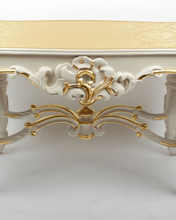 A Rococo white painted and parcel gilt writing table