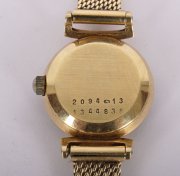Zlaté hodinky Doxa