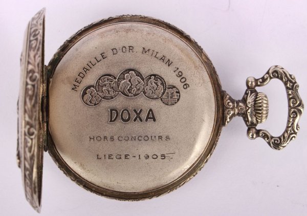 Plasticky zdobené,kapesní hodinky Doxa
