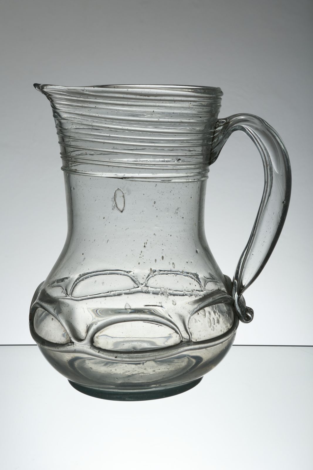 A large baroque glass pitcher