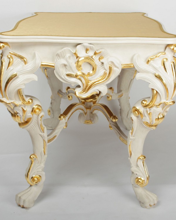 A Rococo white painted and parcel gilt writing table